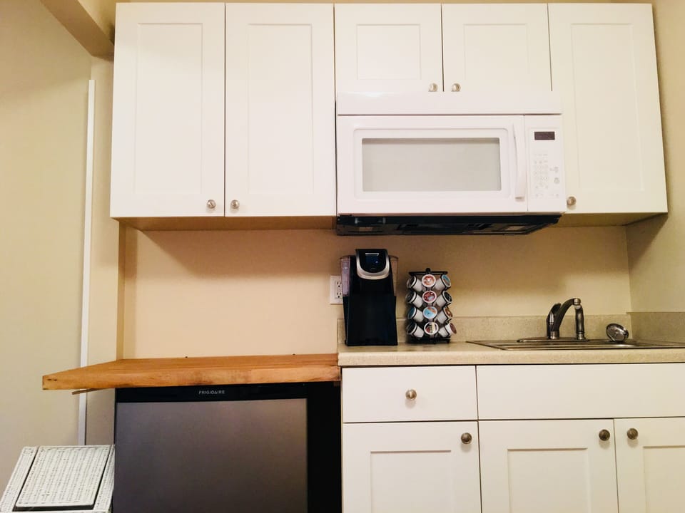 Keurig coffeemaker & coffees, paper towels, trash bags, & dish soap are provided