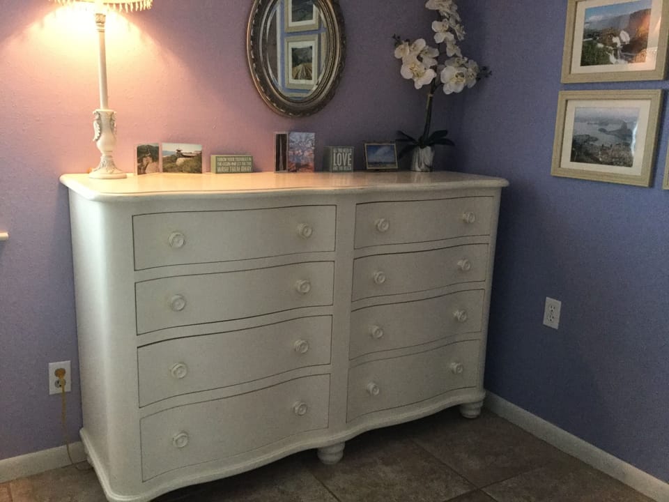 Ample storage space with closet and chests in principal bedroom