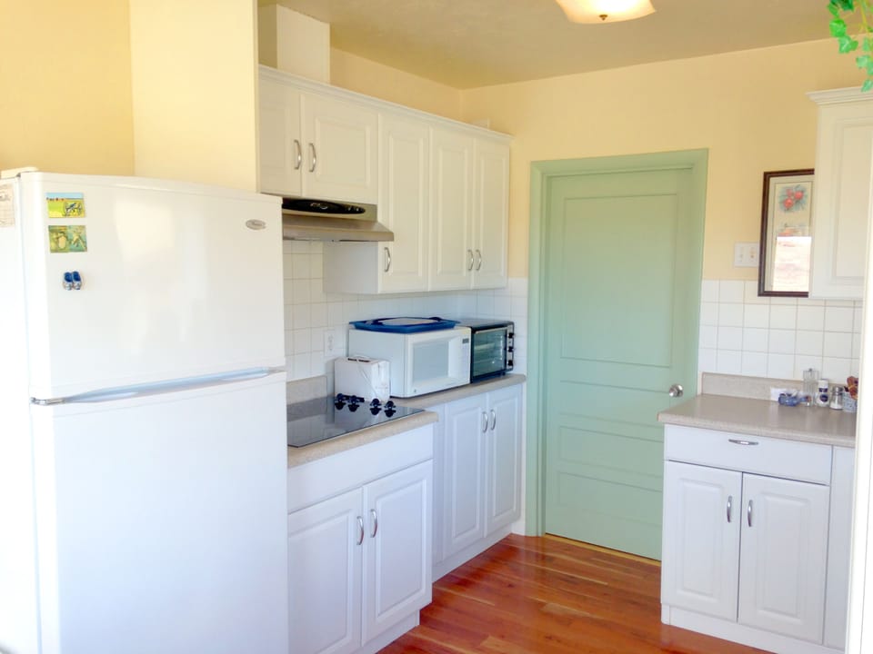 kitchen with entrance to master bedroom and laundry room