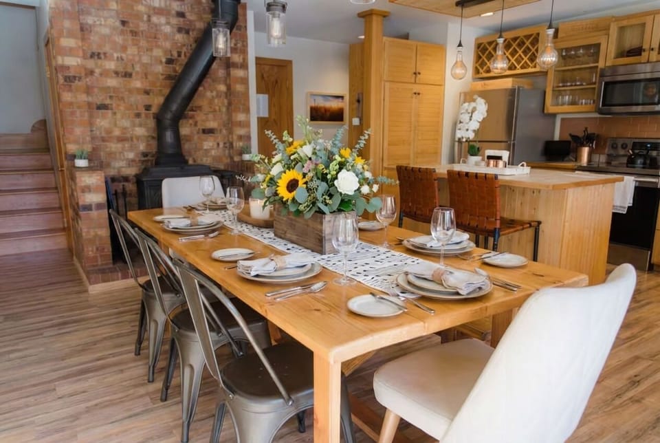 Farmhouse Gathering Table — The heart of the home—farmhouse-style dining for shared meals, game nights, and après stories that stretch long past dessert. 🍷🎲