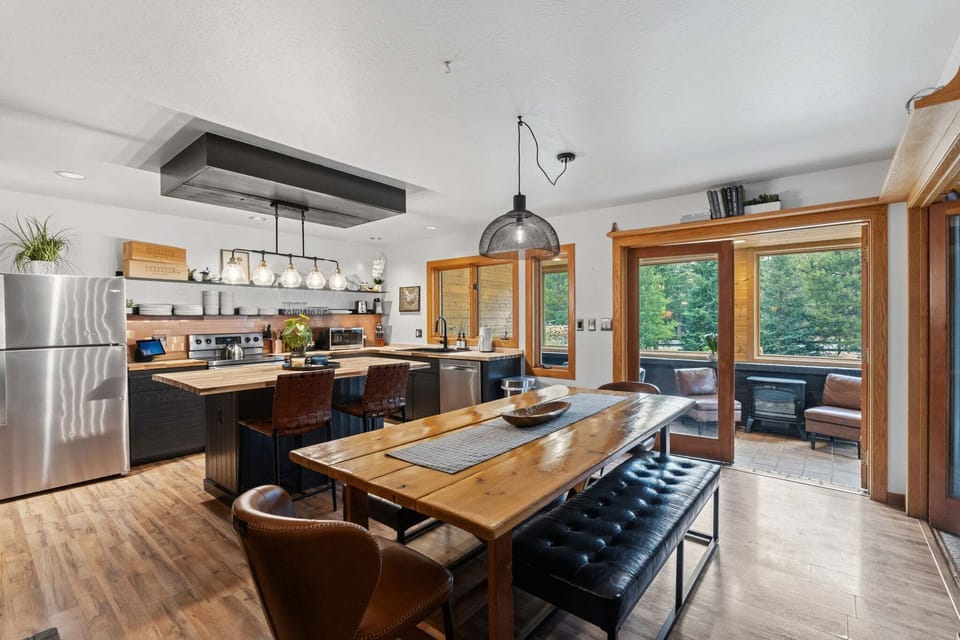 Farmhouse Gathering Table — The heart of the home—farmhouse-style dining for shared meals, game nights, and après stories that stretch long past dessert. 🍷🎲