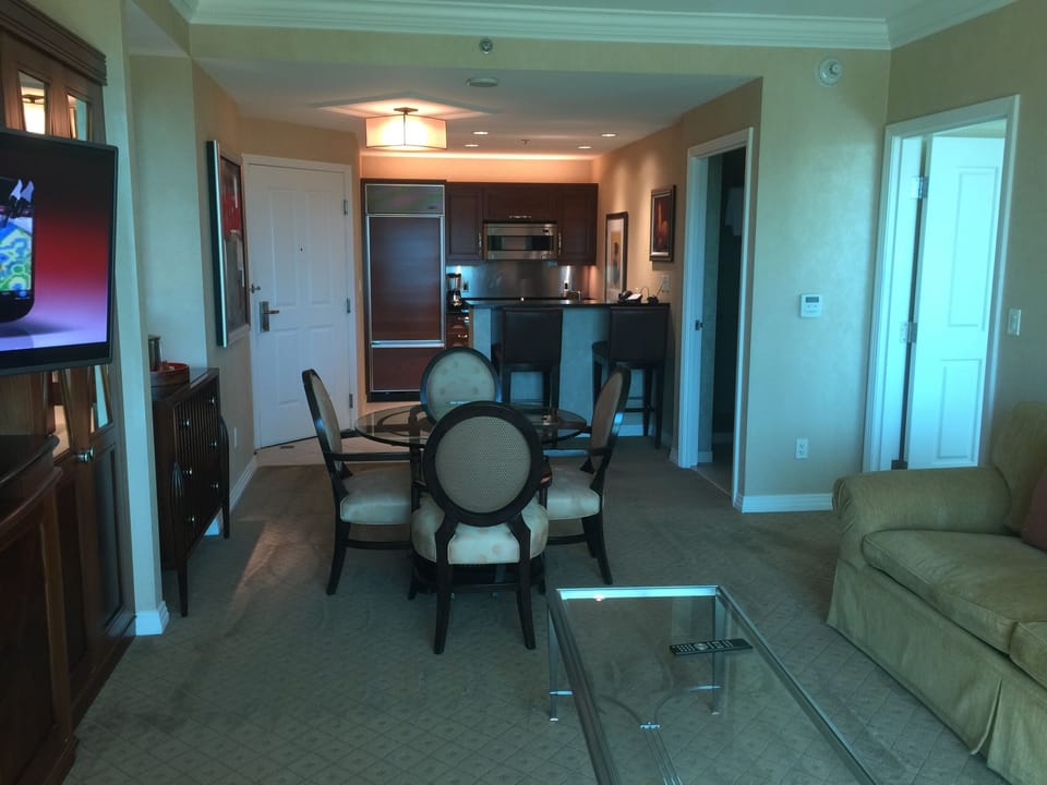 Living room with sofa bed, tv, bath room with shower. 