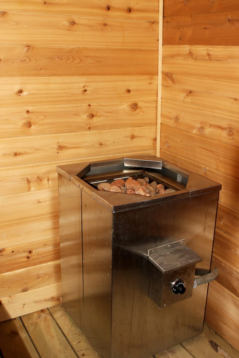 Sauna heating unit in basement sauna room. There is now a new heating unit. 