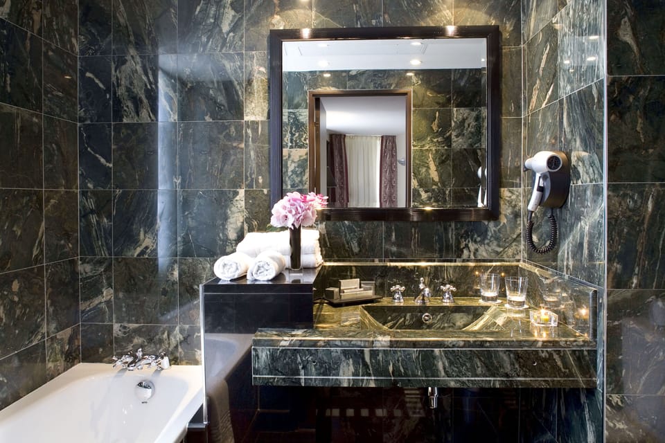  Prestige Suite | Bathroom | Combined shower/tub, deep soaking tub, hair dryer, slippers
