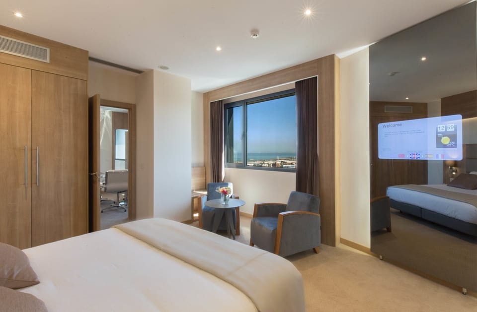 Premium Suite, Sea View | Minibar, in-room safe, desk, blackout drapes