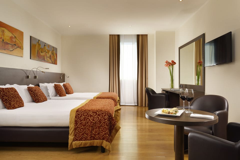 Family Room | Premium bedding, down comforters, minibar, in-room safe