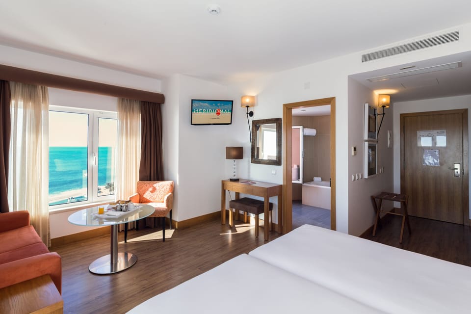 Suite, Sea View | Minibar, in-room safe, desk, free WiFi