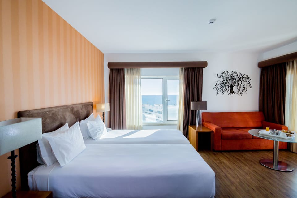 Suite, Sea View | Minibar, in-room safe, desk, free WiFi