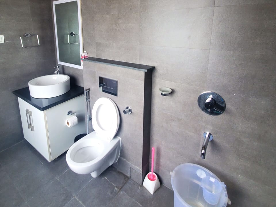 BROWN VILLA WITH A BIG PRIVATE SIT-OUT | Bathroom | Rainfall showerhead, free toiletries, bathrobes, bidet