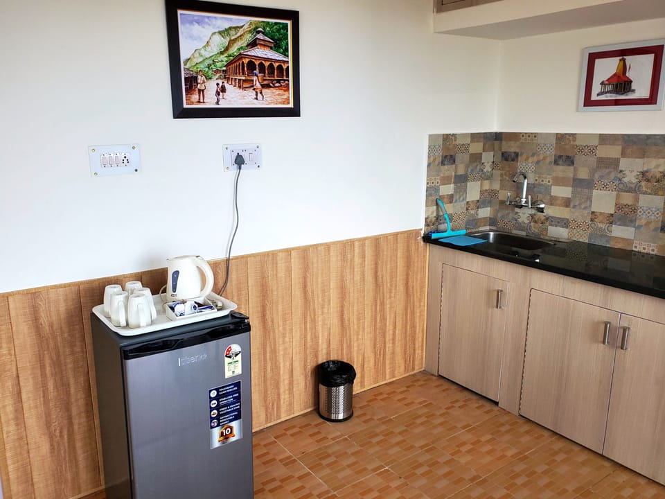 BROWN VILLA WITH A BIG PRIVATE SIT-OUT | Private kitchen | Electric kettle, cleaning supplies