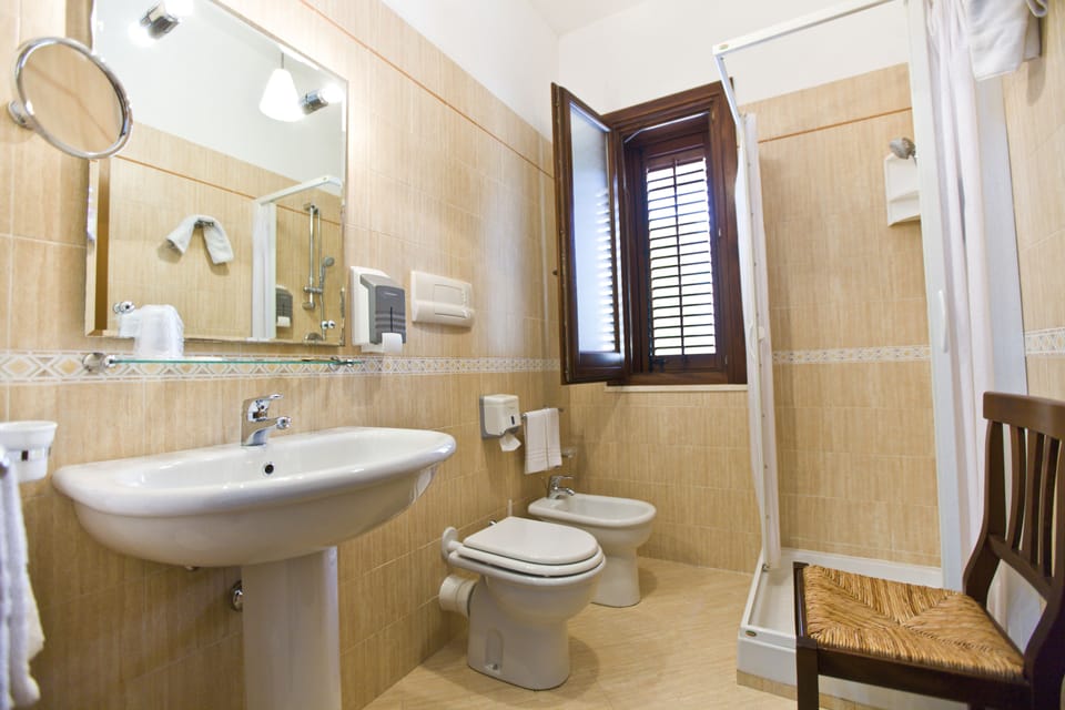 Economy Double Room | Bathroom | Shower, free toiletries, slippers, towels