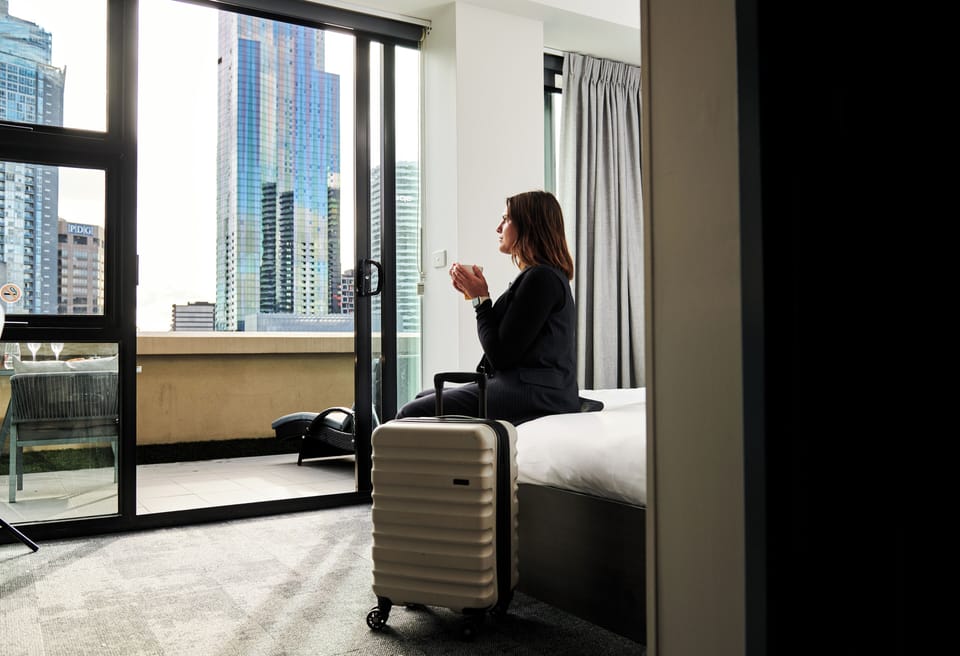Queen Ensuite Room with Balcony and City View | Bed sheets