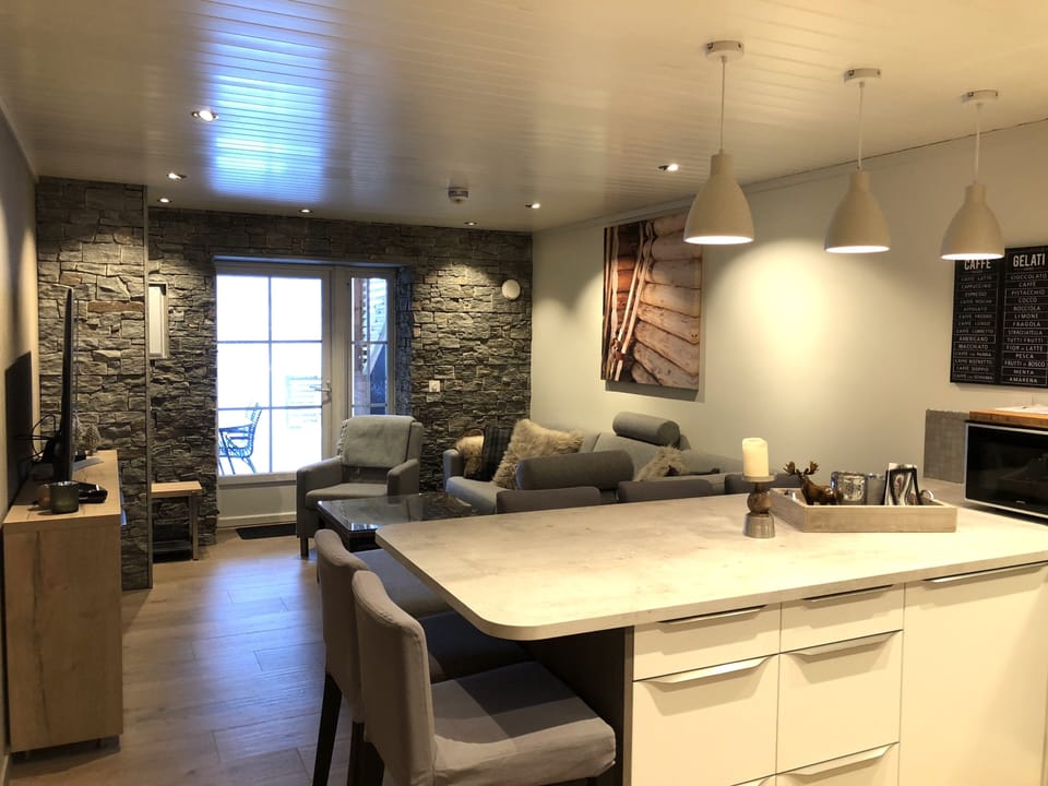 Deluxe Apartment, 2 Bedrooms | Living area | 22-inch flat-screen TV with cable channels, TV, foosball