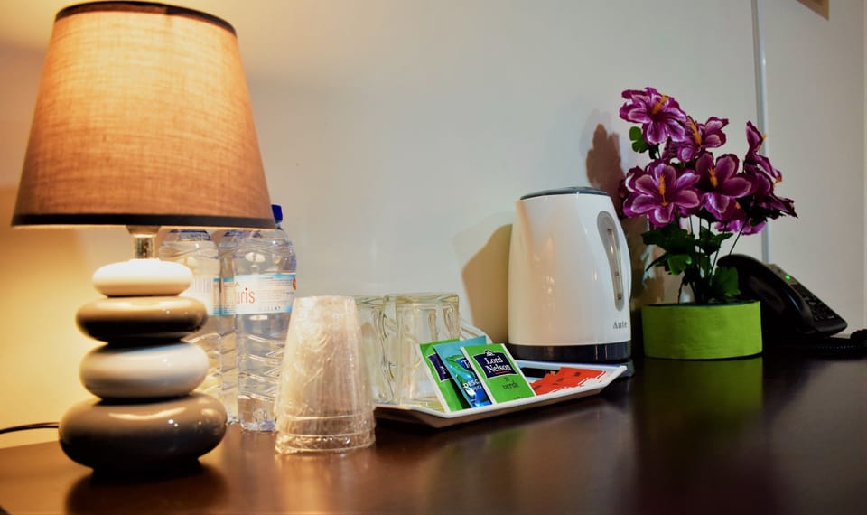 Deluxe Triple Room, Private Bathroom | Coffee and/or coffee maker