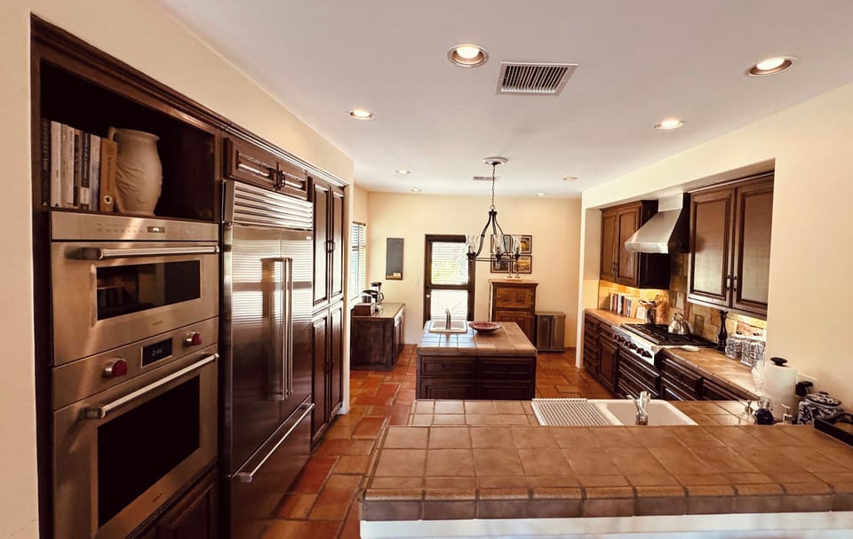 Kitchen Features Wolf Professional And Sub-Zero Appliances Including Double Oven