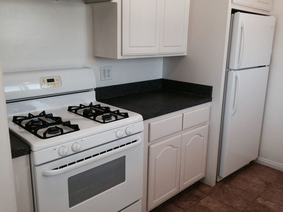 Clean bright Kitchen fully stocked.