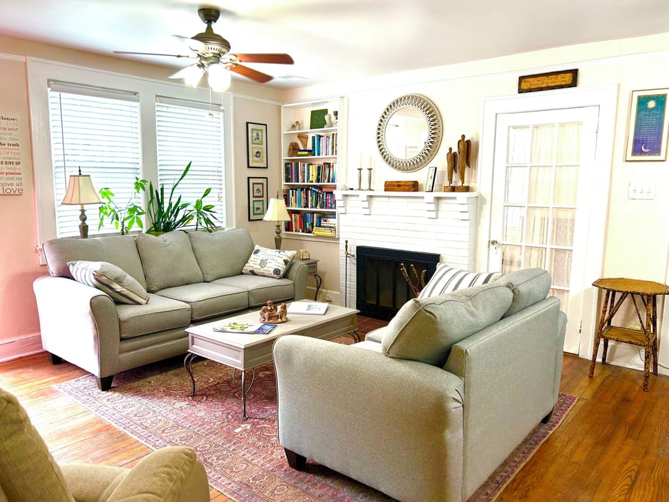 Open concept living space with fireplace and lift chair.  