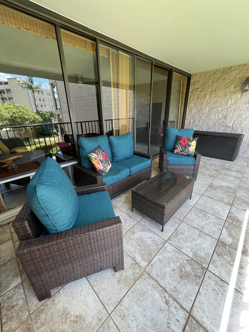 Tiled Full Length Lanai, Soft Cushioned Wicker Furniture, Beach Bin