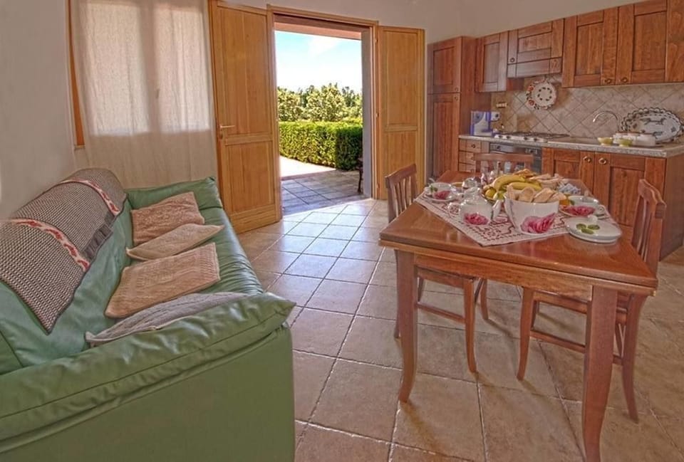 Family Apartment, 1 Bedroom | Private kitchen | Fridge, microwave, stovetop, coffee/tea maker