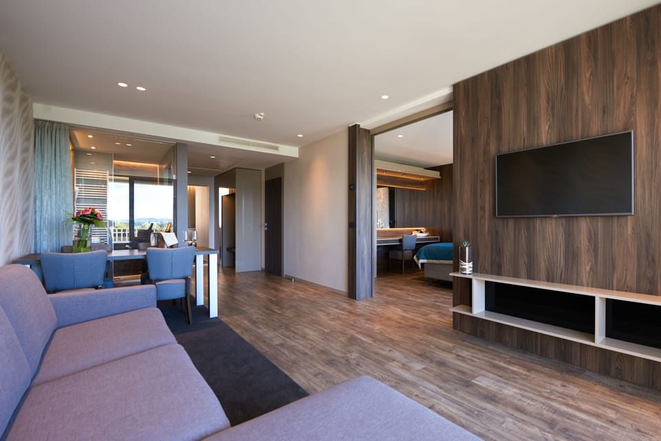Family Suite, 2 Bedrooms, Balcony, Park View | Living area | Flat-screen TV
