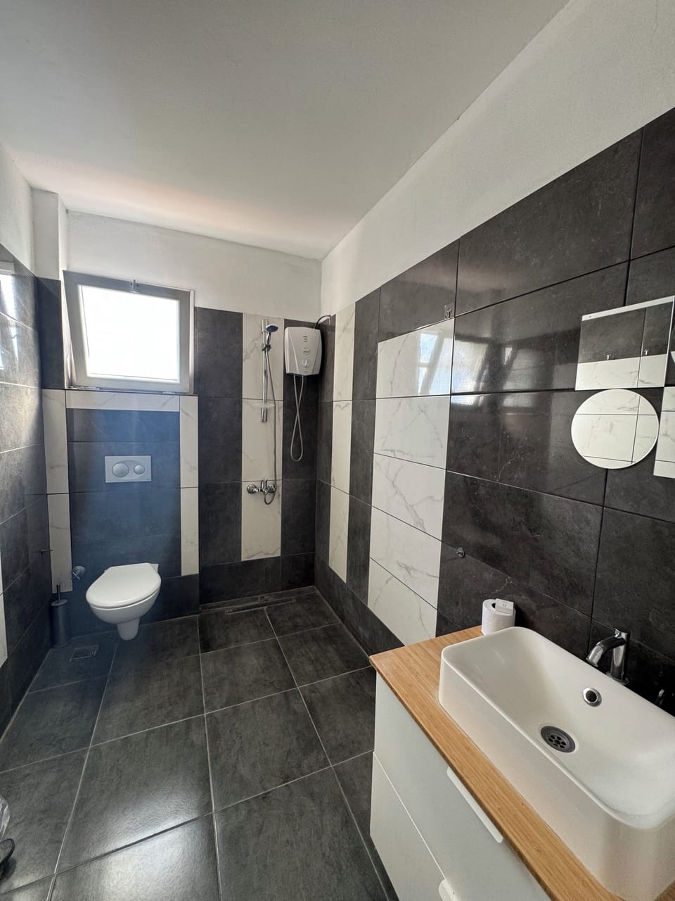 Shower, hair dryer, slippers, towels