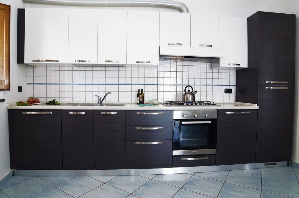 Apartment | Private kitchen | Full-size fridge, oven, stovetop, coffee/tea maker