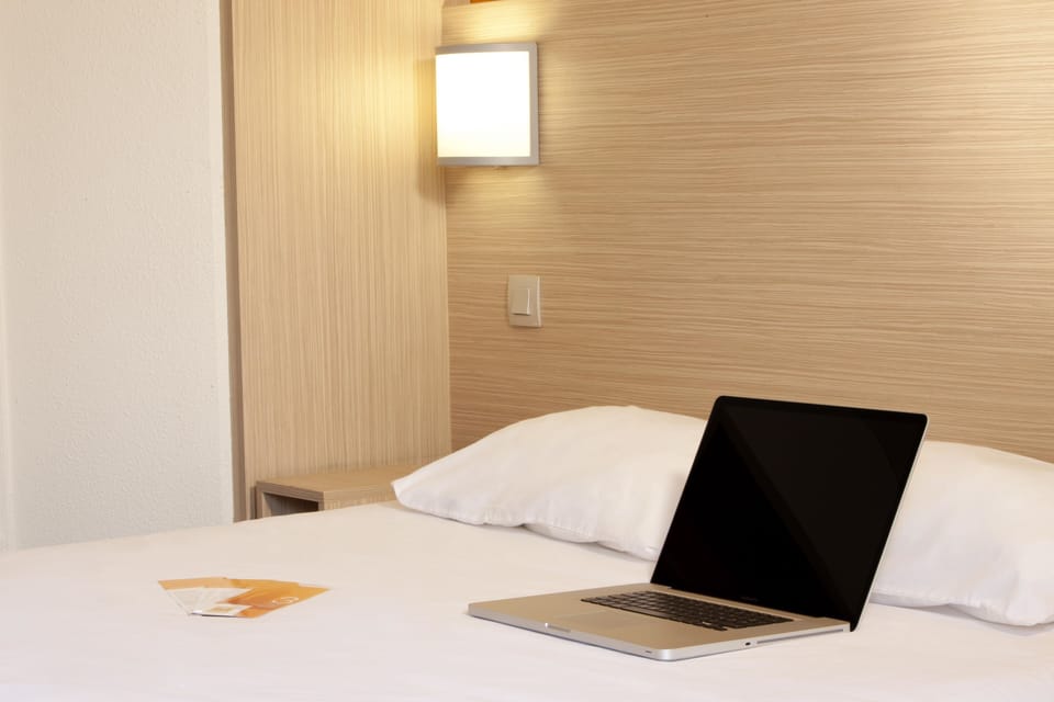 Premium bedding, pillowtop beds, desk, laptop workspace