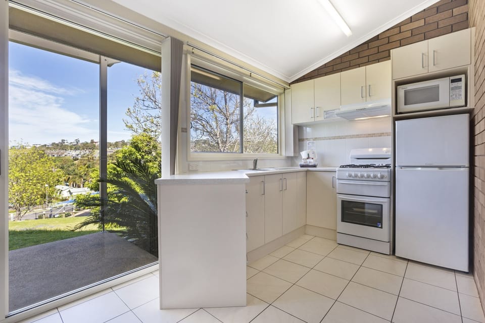 Holiday Villa, 2 Bedrooms | Private kitchen | Coffee/tea maker, full-size fridge, microwave, stovetop