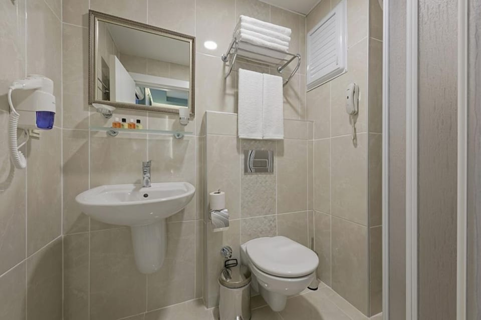 Shower, free toiletries, hair dryer, slippers
