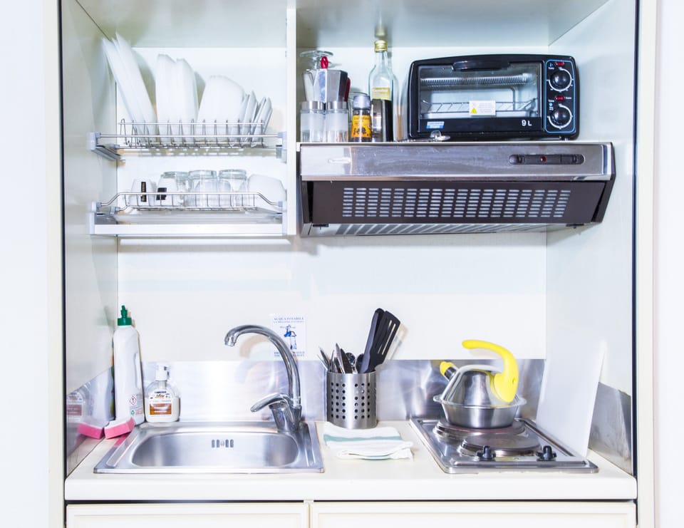 Deluxe Room, Kitchenette | Private kitchenette | Full-size fridge, microwave, stovetop, espresso maker