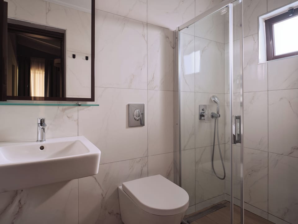 Shower, free toiletries, hair dryer, slippers