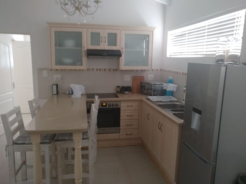 Executive Apartment, 1 Bedroom, Garden View (Baobab Suite) | Private kitchen | Shared fridge, microwave, coffee/tea maker, electric kettle