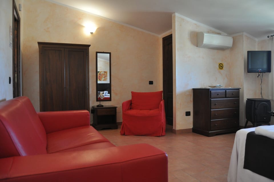 Classic Suite | Living area | 50-inch flat-screen TV with cable channels