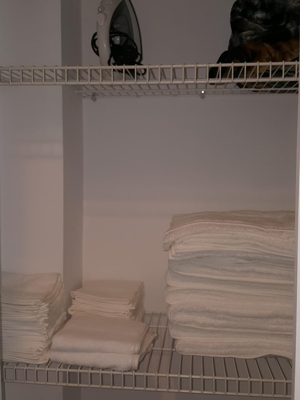 Linen closet equipped with extra towels, blankets and necessities 