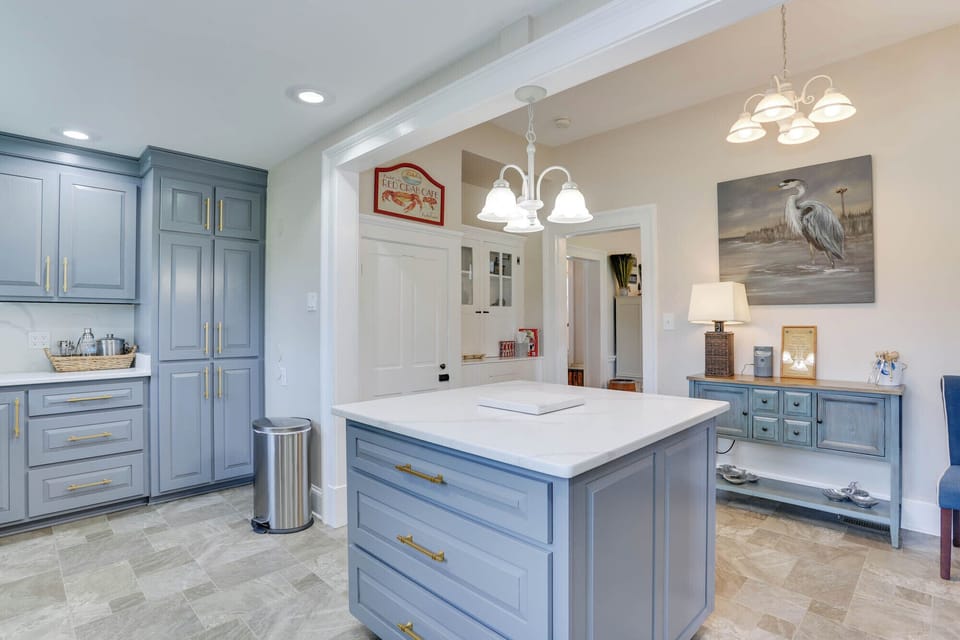 Two large full-length pull-out drawers for guests' items. Local artist art shown