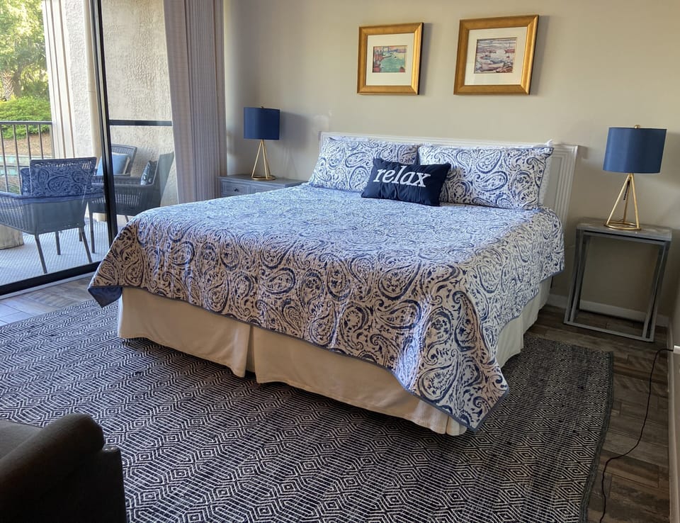 Master suite with comfortable/new king set, opens to balcony with water views