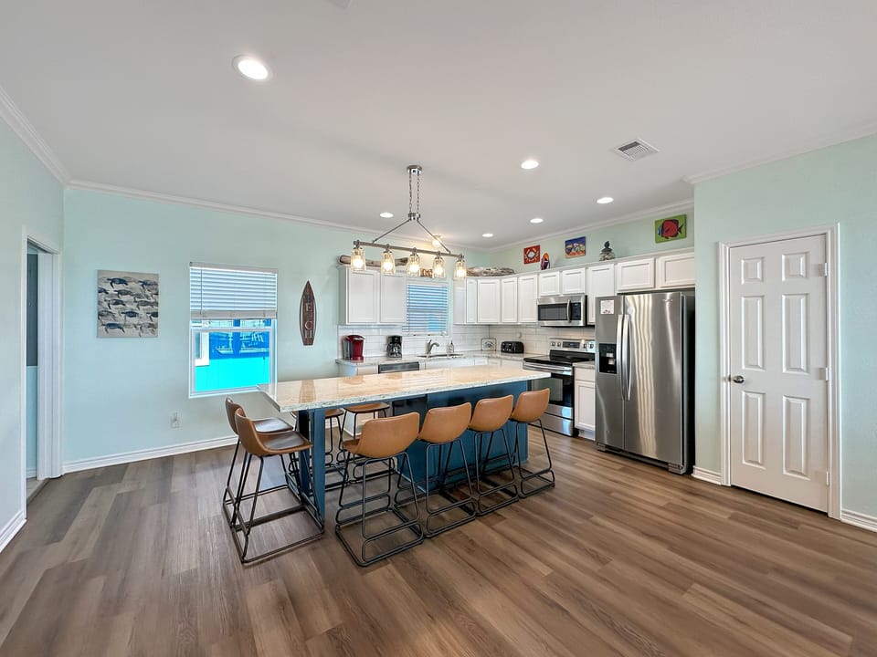 Whether you're cooking or just snacking, the open-concept kitchen is perfect for family meals or casual bites.