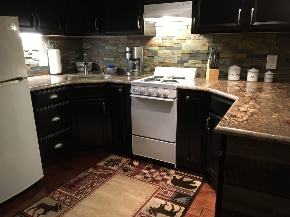 Brand New Kitchen, granite counter tops, slate backsplash and old barn wood 