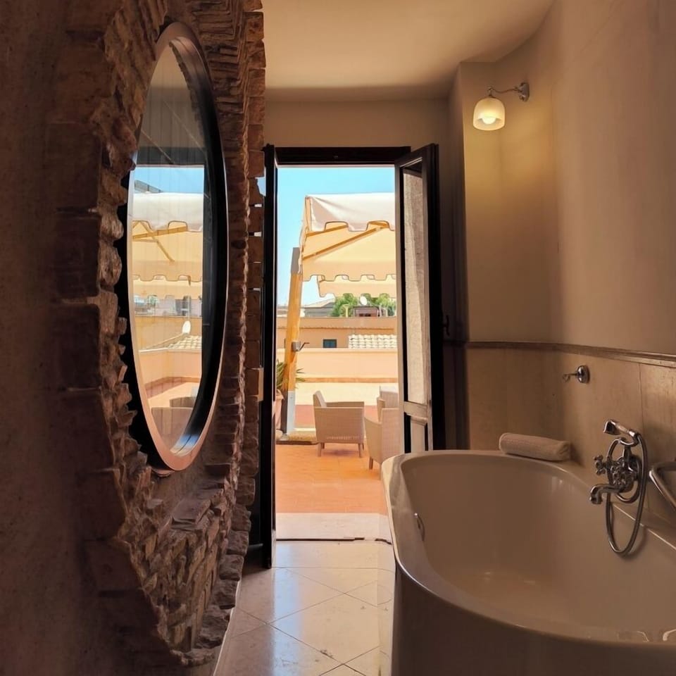 Prestige Deluxe "Savelli" | Bathroom | Shower, rainfall showerhead, hair dryer, slippers