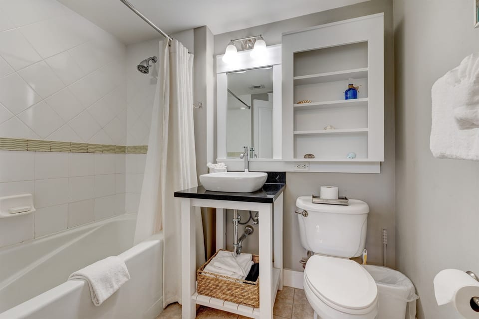 The en suite master bathroom has a modern vessel sink and upgraded shower head!