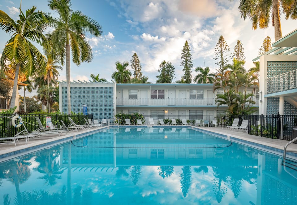 Large, heated pool with lots of deck space and chairs.