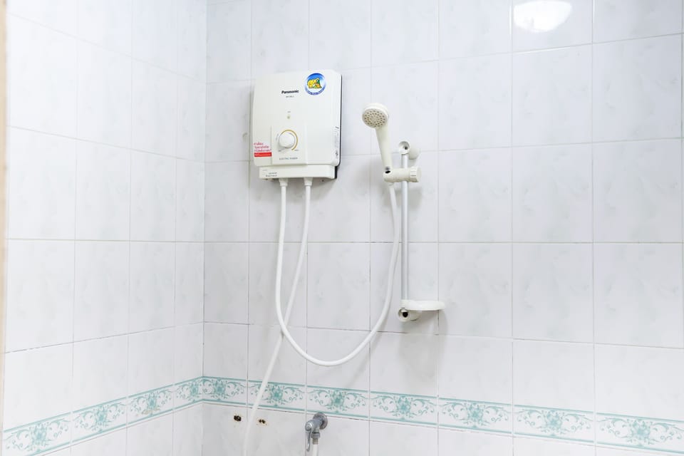 Twin Room with Air Conditioned | Bathroom | Shower, free toiletries, towels, soap