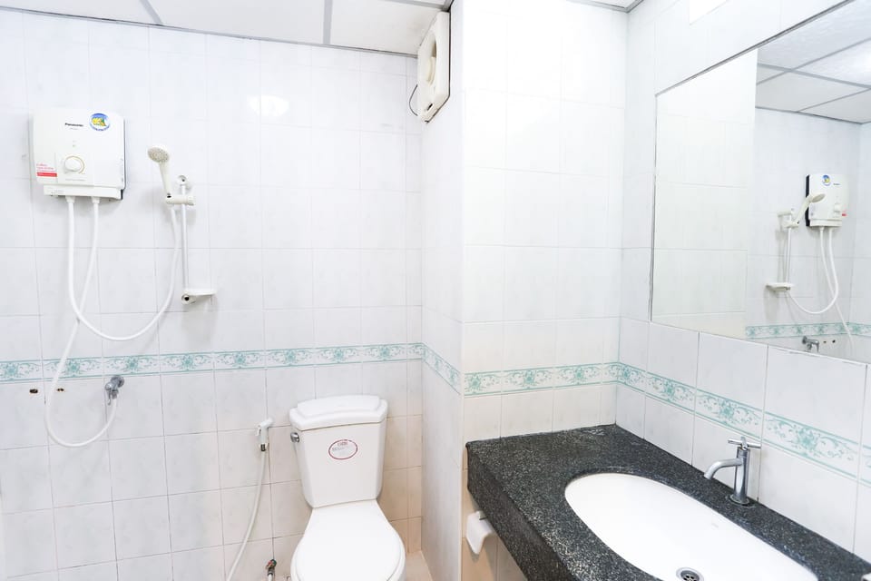 Twin Room with Air Conditioned | Bathroom | Shower, free toiletries, towels, soap