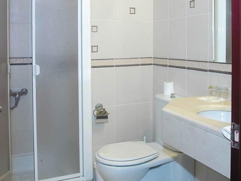 Shower, hair dryer, slippers, towels