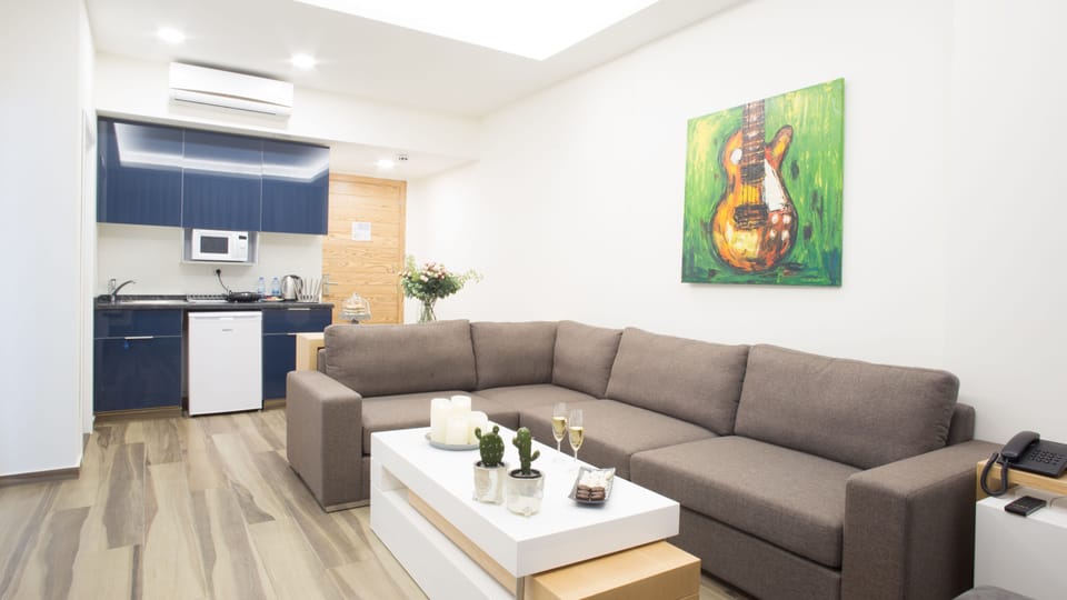Standard Apartment, 1 Bedroom | Living area | 40-inch LED TV with cable channels, TV