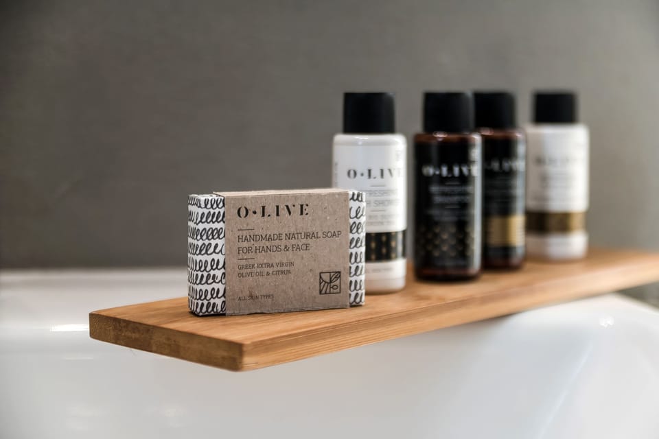 Deluxe Room | Bathroom | Shower, designer toiletries, hair dryer, towels