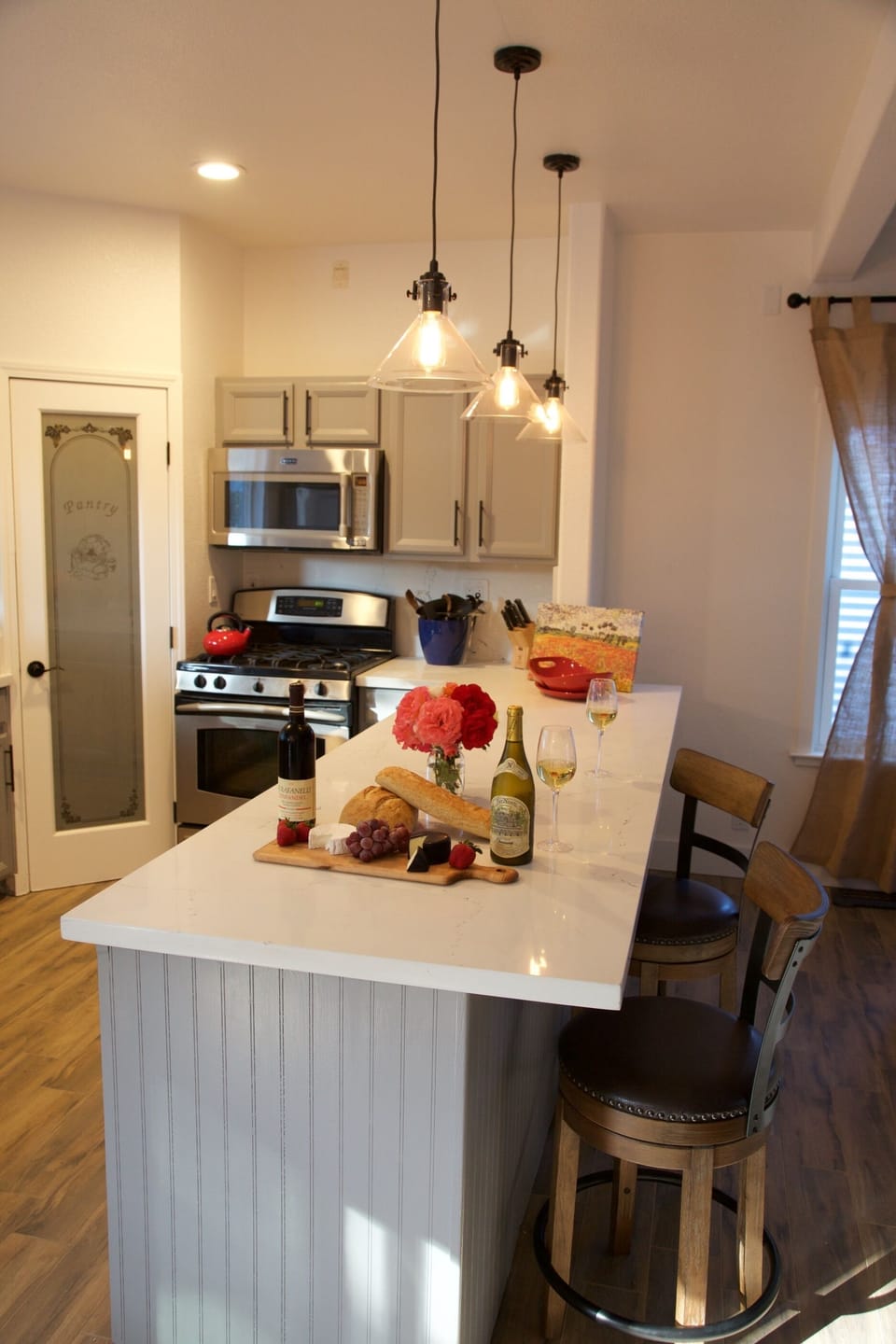 Stocked Kitchen, Gas Range, pantry, Microwave, seats 4 with Counter Top Stools.