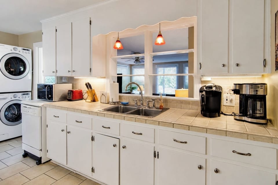 Kitchen with dishwasher and coffee makers