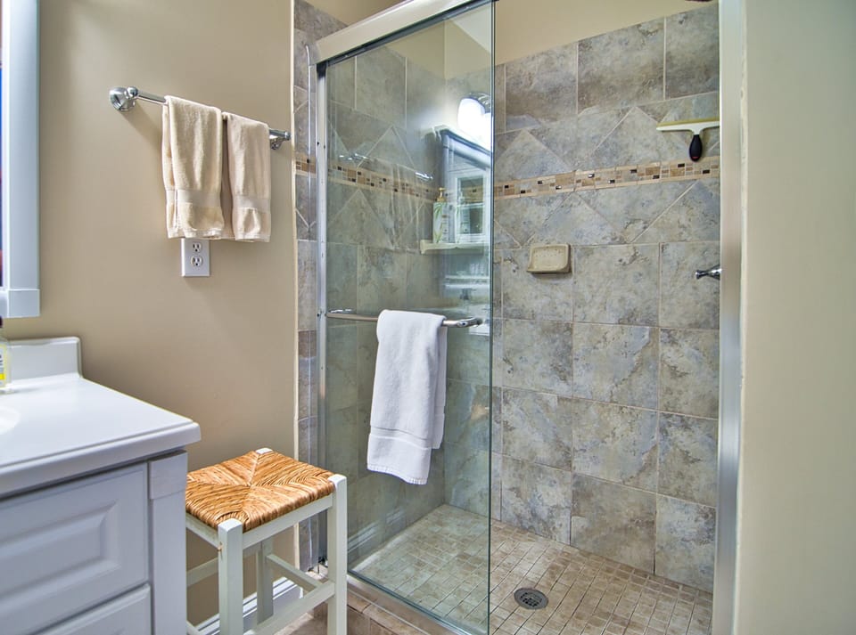 Full bathroom with shower adjoins back corner Bedroom 2