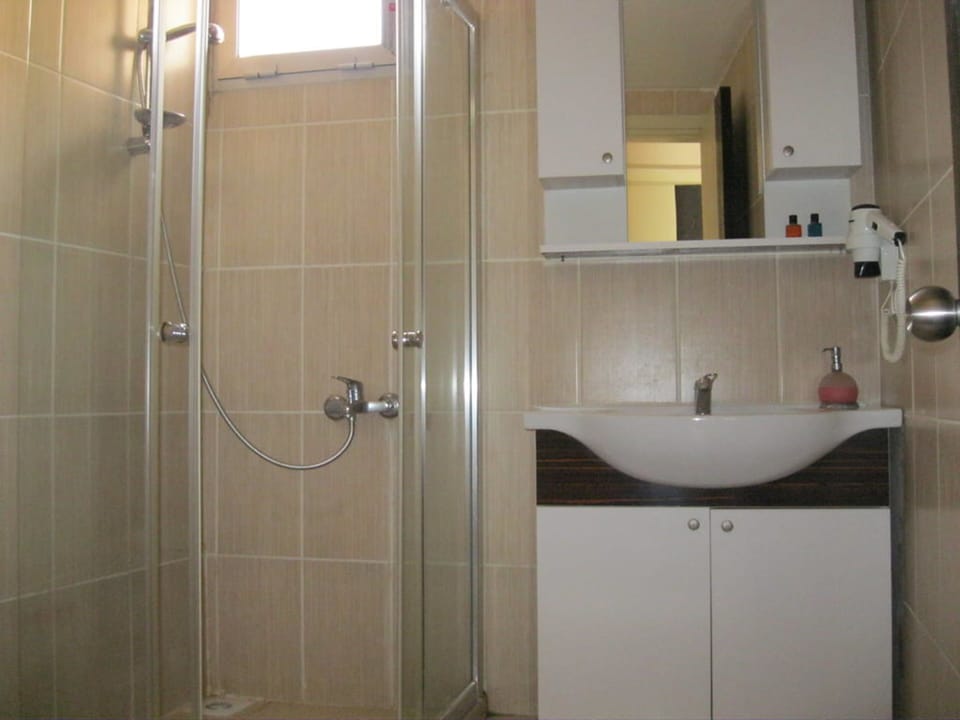 Shower, free toiletries, hair dryer, slippers